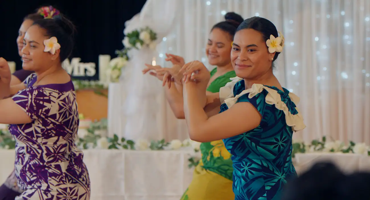 Hibiscus dances at a wedding in 'Hibiscus & Ruthless'.