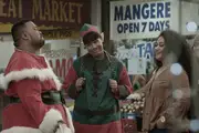 A Tongan Santa, a Samoan Elf and bemused women meet at Mangere Town Center.